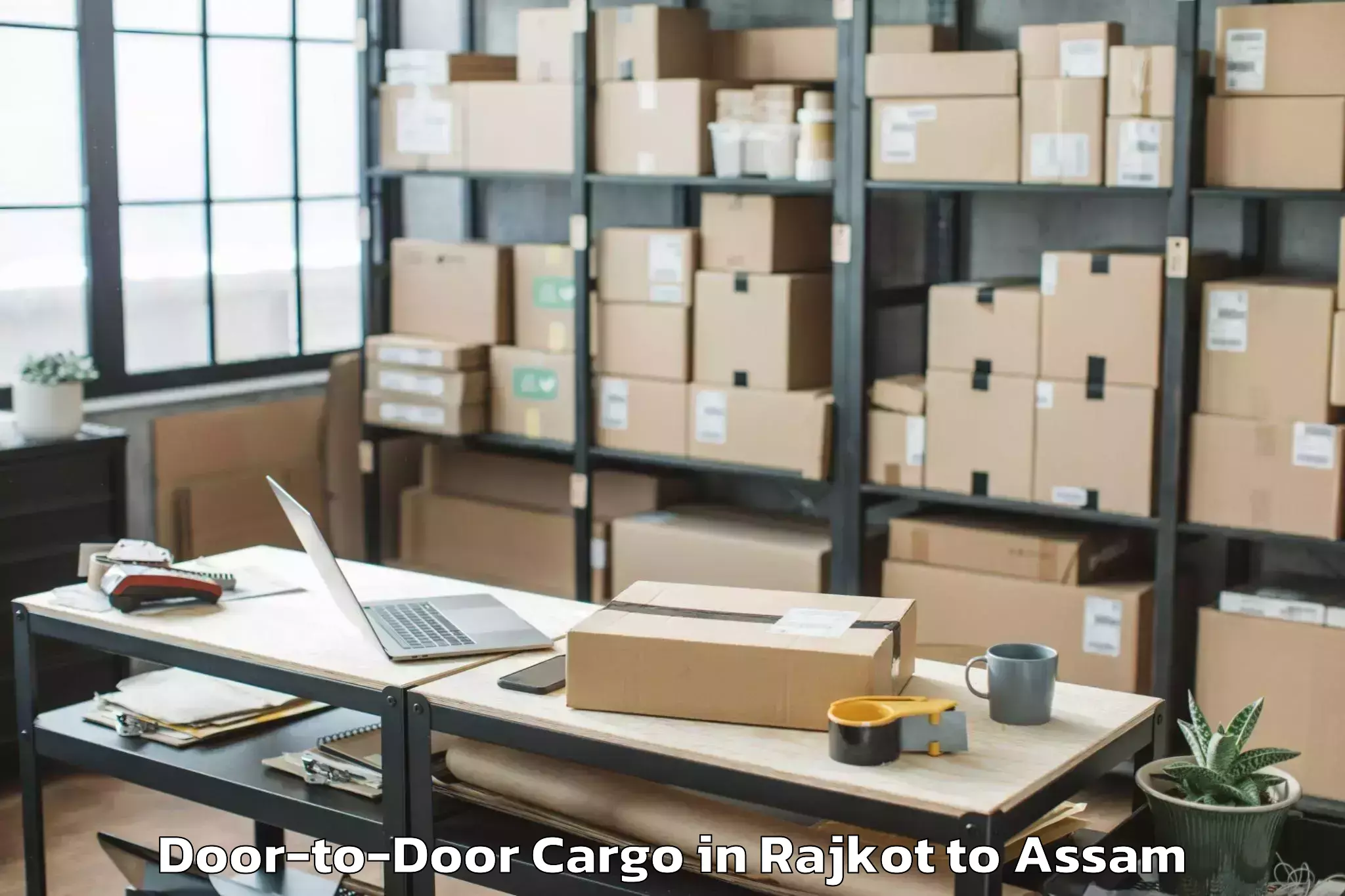 Easy Rajkot to Bokajan Door To Door Cargo Booking